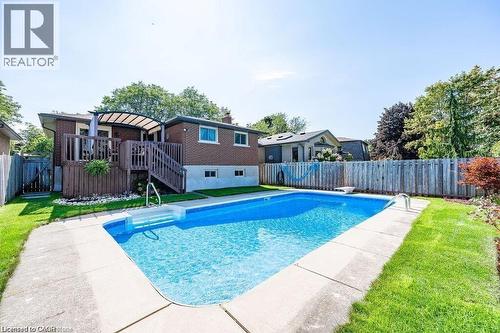 View of pool with a fenced backyard, a wooden deck, and a patio - 364 Roselawn Place, Waterloo, ON - Outdoor With In Ground Pool With Deck Patio Veranda