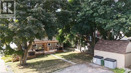View of grassy yard featuring a wooden deck - 358 Dundas Street E, Hamilton, ON - Outdoor