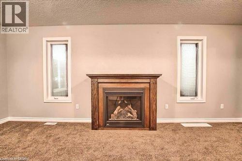 1360 Caen Avenue, Woodstock, ON - Indoor Photo Showing Living Room With Fireplace