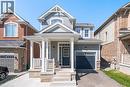 View of front of property with covered porch, asphalt driveway, a garage, and a shingled roof - 28 Pickett Place, Cambridge, ON  - Outdoor With Facade 