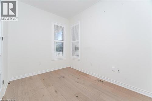 Unfurnished room with light wood-style flooring and baseboards - 28 Pickett Place, Cambridge, ON - Indoor Photo Showing Other Room