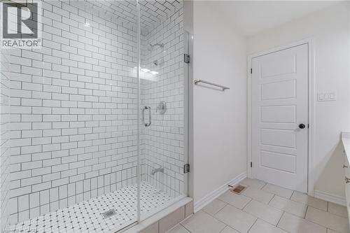 Full bath featuring vanity, light tile patterned flooring, and a stall shower - 28 Pickett Place, Cambridge, ON - Indoor Photo Showing Bathroom