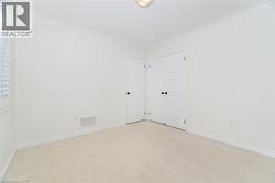 Empty room with carpet floors and ornamental molding - 