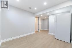 Unfurnished room with recessed lighting and light wood finished floors - 