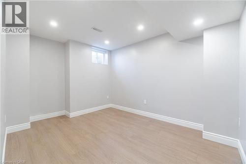 Below grade area with light wood-type flooring and recessed lighting - 28 Pickett Place, Cambridge, ON - Indoor Photo Showing Other Room