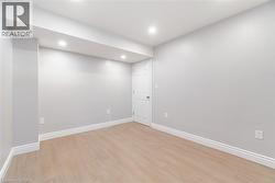 Spare room with light wood finished floors and recessed lighting - 