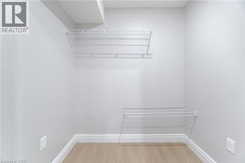 Spacious closet with light wood-style floors - 28 Pickett Place, Cambridge, ON - Indoor With Storage