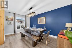 Dining space with light wood-type flooring - 