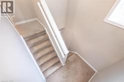 Stairway featuring carpet flooring - 