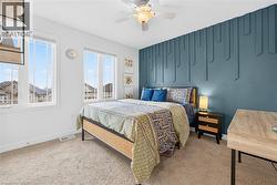 Bedroom with carpet floors and ceiling fan - 