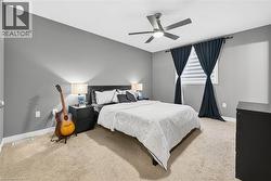 Bedroom with carpet and a ceiling fan - 
