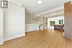 Spare room with light wood finished floors and recessed lighting - 