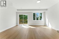 Unfurnished room with healthy amount of natural light and light wood-style flooring - 
