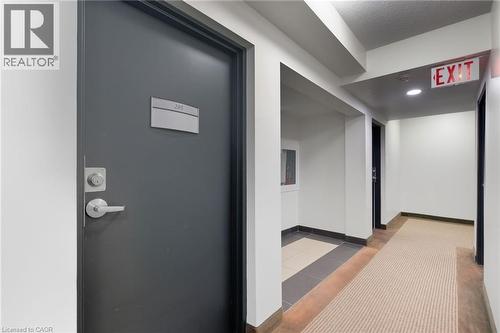 Hall featuring baseboards - 17 King Street E Unit# 205, Dundas, ON 