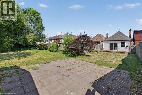 Fenced backyard featuring a wooden deck - 111 Hillyard Street, Hamilton, ON - Outdoor