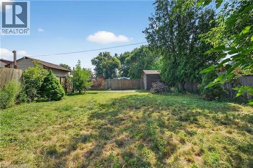 Fenced backyard with a storage unit - 111 Hillyard Street, Hamilton, ON - Outdoor