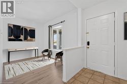 Entryway with light tile flooring - 