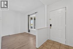 Foyer featuring light tile floors - 