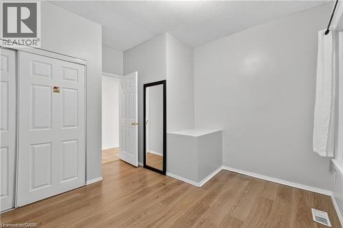 Unfurnished bedroom a closet, and light wood-type flooring - 111 Hillyard Street, Hamilton, ON - Indoor Photo Showing Other Room