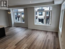 Unfurnished dining area with light wood-style floors and healthy amount of natural light - 