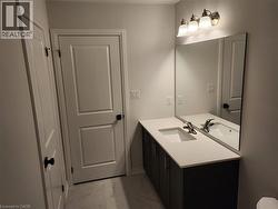 Bathroom featuring light marble finish floors and vanity - 