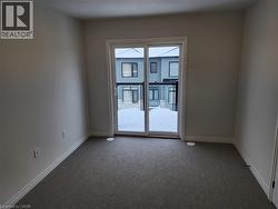 Spare room with carpet floors and baseboards - 