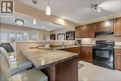 Large kitchen with breakfast bar - 