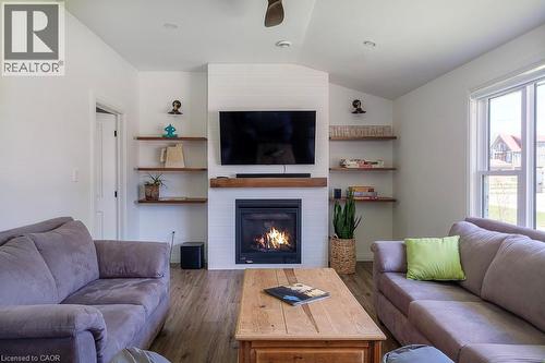 197 Cedar Drive, Turkey Point, ON - Indoor Photo Showing Living Room With Fireplace