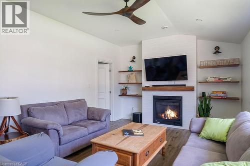 197 Cedar Drive, Turkey Point, ON - Indoor Photo Showing Living Room With Fireplace
