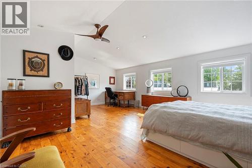 Bedroom with vaulted ceiling, light wood finished floors, a ceiling fan, a desk, and recessed lighting - 197 Cedar Drive, Turkey Point, ON - Indoor Photo Showing Bedroom