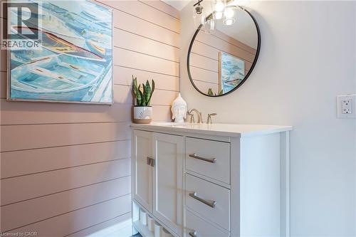 Bathroom featuring vanity and wooden walls - 197 Cedar Drive, Turkey Point, ON - Indoor Photo Showing Bathroom