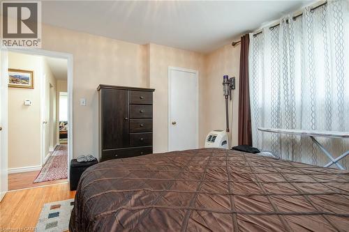 Bedroom with wood finished floors and baseboards - 129 River Road E, Kitchener, ON - Indoor Photo Showing Bedroom
