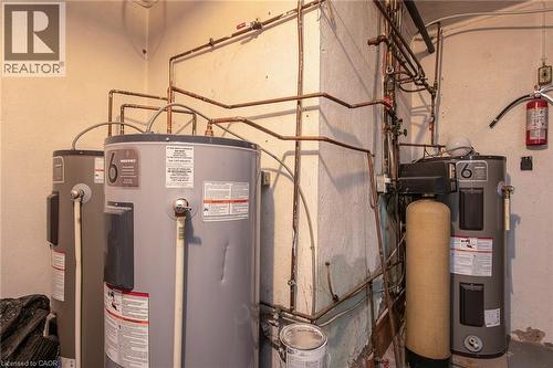 Utilities featuring electric water heater - 129 River Road E, Kitchener, ON - Indoor Photo Showing Basement