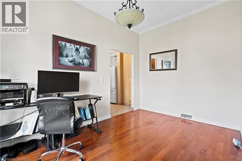 Office area featuring crown molding and wood finished floors - 5368 Menzie Street, Niagara Falls, ON - Indoor Photo Showing Office