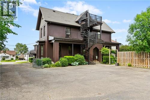 Multi unit property with stairs, roof with shingles, and a balcony - 5368 Menzie Street, Niagara Falls, ON - Outdoor