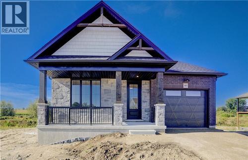 upgraded aluminum railing - 117 Thackeray Way, Harriston, ON - Outdoor With Deck Patio Veranda