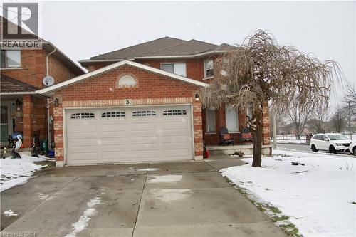 View of front facade with an attached garage, brick siding, and driveway - 3 Jacqueline Boulevard, Hamilton, ON - Outdoor