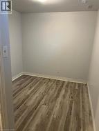Empty room with wood finished floors and baseboards - 