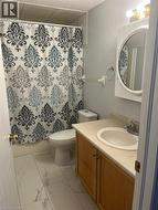 Full bathroom with vanity, light marble finish floors, and shower / bath combination with curtain - 