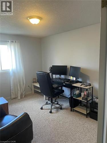 Home office featuring a textured ceiling and light carpet - 110 Adler Drive, Cambridge, ON - Indoor Photo Showing Office