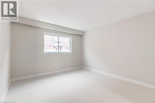 Carpeted spare room with baseboards - 2340 King Street E, Hamilton, ON - Indoor Photo Showing Other Room