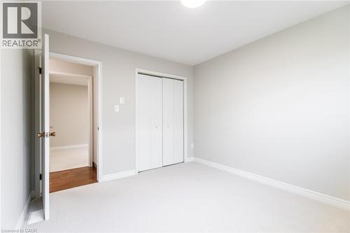 Unfurnished bedroom with carpet, a closet, and baseboards - 2340 King Street E, Hamilton, ON - Indoor