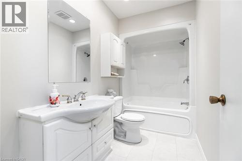 Bathroom with vanity, tile patterned floors, toilet, and shower / tub combination - 2340 King Street E, Hamilton, ON - Indoor Photo Showing Bathroom