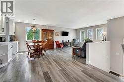 Dining room with light wood-style floors and baseboards - 