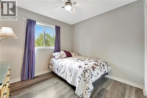 Bedroom with light wood-style floors and a ceiling fan - 1565 Old Brock Street, Vittoria, ON - Indoor Photo Showing Bedroom