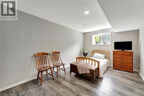 Bedroom featuring light wood-type flooring and baseboards - 1565 Old Brock Street, Vittoria, ON - Indoor