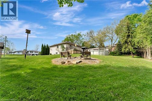 View of green lawn with a deck - 1565 Old Brock Street, Vittoria, ON - Outdoor
