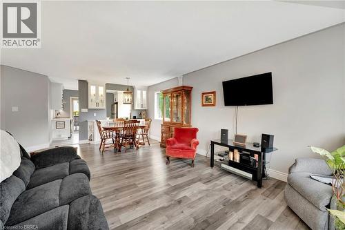 Living area featuring light wood-style floors and baseboards - 1565 Old Brock Street, Vittoria, ON - Indoor Photo Showing Living Room