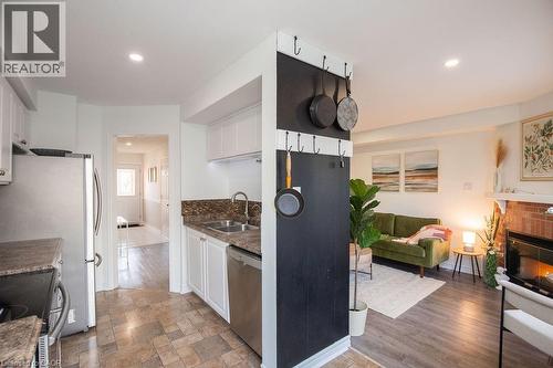 2350 Grand Ravine Drive Unit# 12, Oakville, ON - Indoor Photo Showing Kitchen With Fireplace With Double Sink