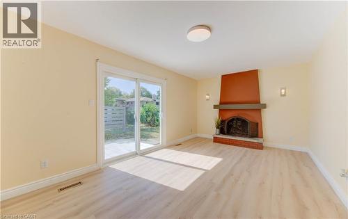 1493 Queens Boulevard, Kitchener, ON - Indoor Photo Showing Living Room With Fireplace